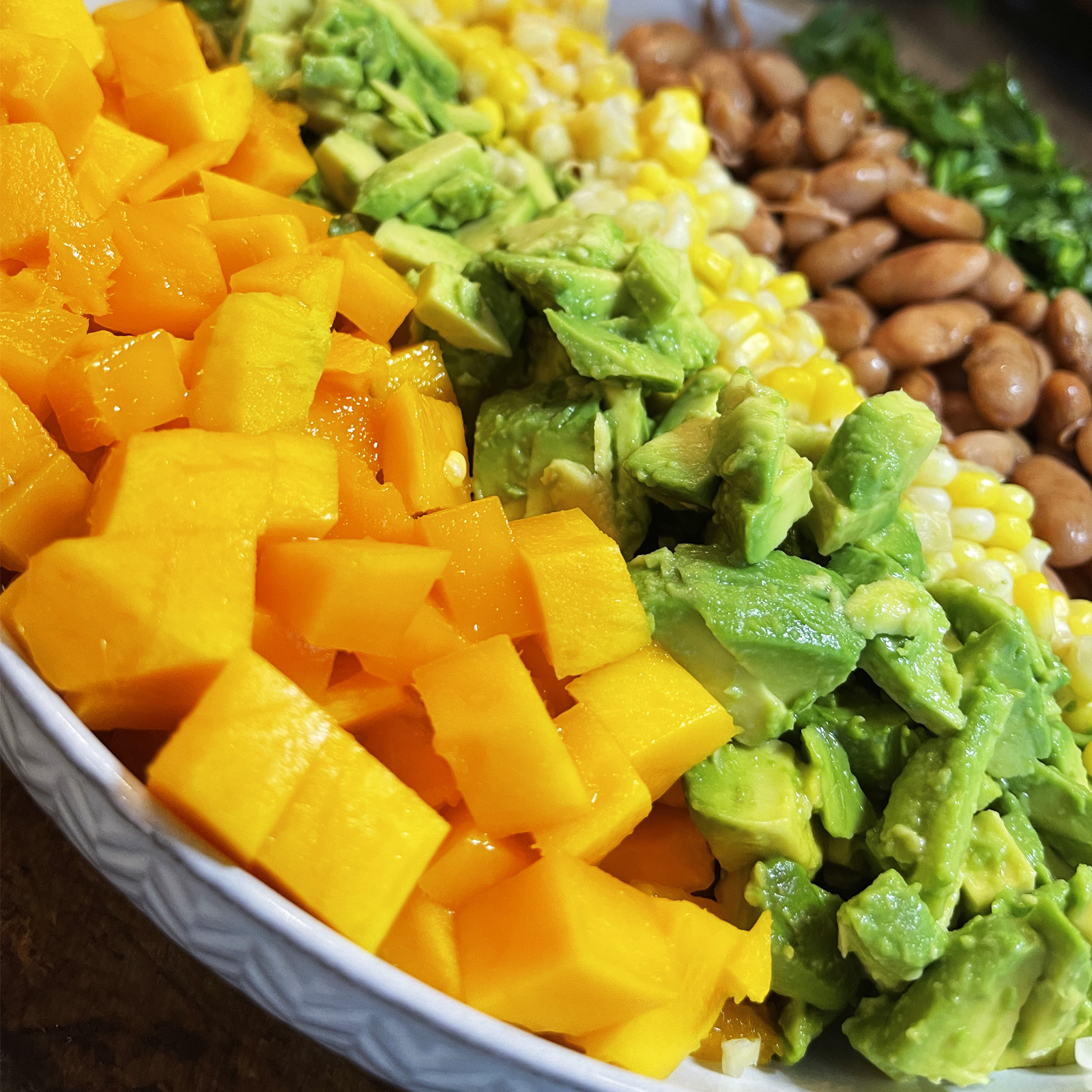Positive pranic Mango/ Avocado salad with beans, corn, and precisely. Sattvic kitchen, plant-based diet